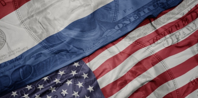 US and Dutch flags, symbolising the Dutch threat of fine against Polymarket and the US CFTC's defence of predictions