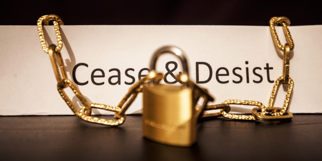 cease and desist text with padlock and chains