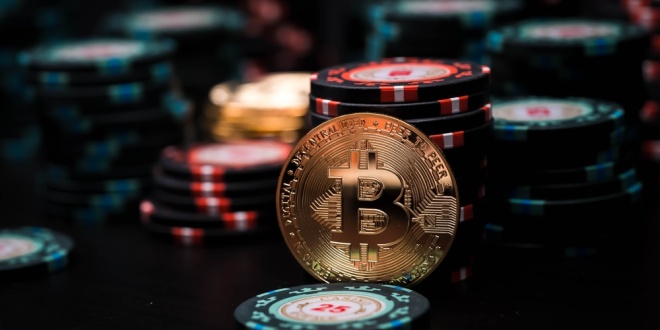 Bitcoin and poker chips, symbolising the crypto gambling product provided by the likes of BC.Game