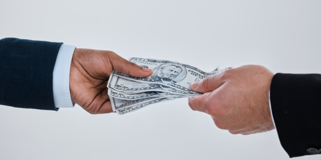 money exchanging hands, representing Codere's potential 2bn sale