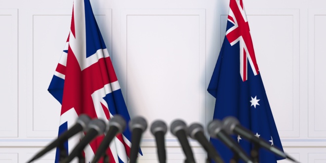 Flags of UK and Australia, where Entain's online performance exceeded expectations