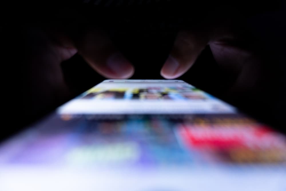 person swiping on mobile