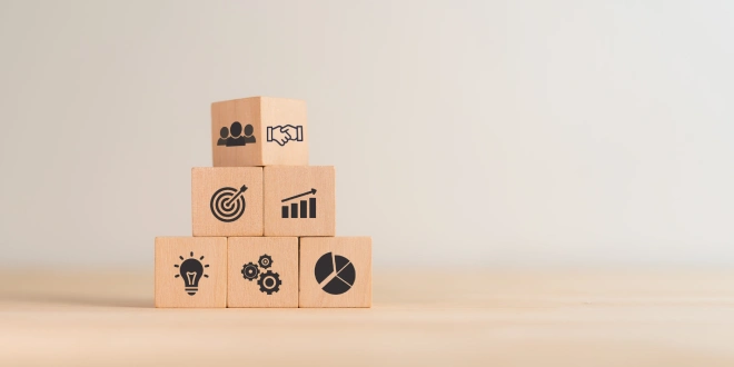 Piled up blocks with symbols that represent aspects of affiliates' work.