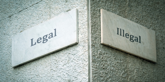 Two signs representing the legal and illegal side