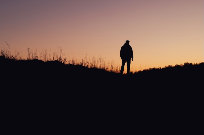 person alone in field