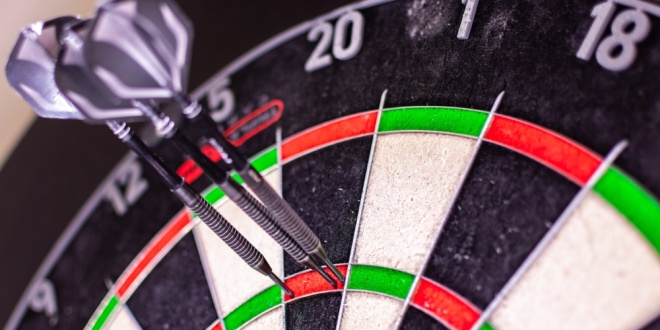 dartboard, representing Kenneth Dart's investments in Evolution and Flutter