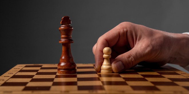 Chess, representing Underdog's acquisition of IG Group