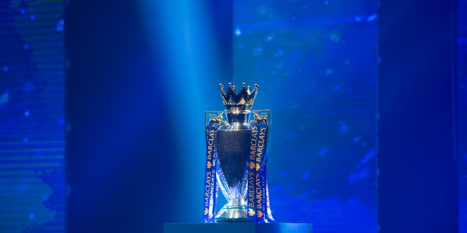 Premier League trophy, representing Super Group's presence in the league after Man Utd deal