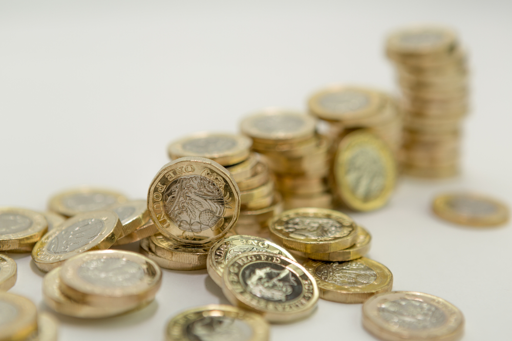 A sack of British pound coins, representing tax