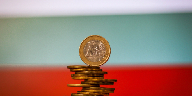 A stack of Euro coins with Bulgaria's flag in the background