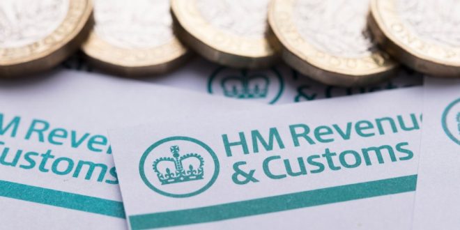 HMRC documents with pound coins above, symbolising gambling taxes
