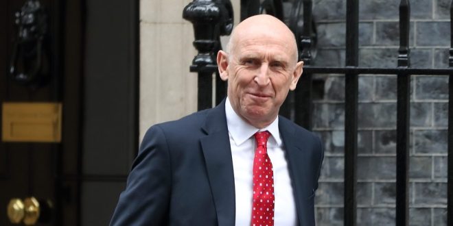John Healey, Chancellor of the Exchequer, with the classic red brief case of the UK budget